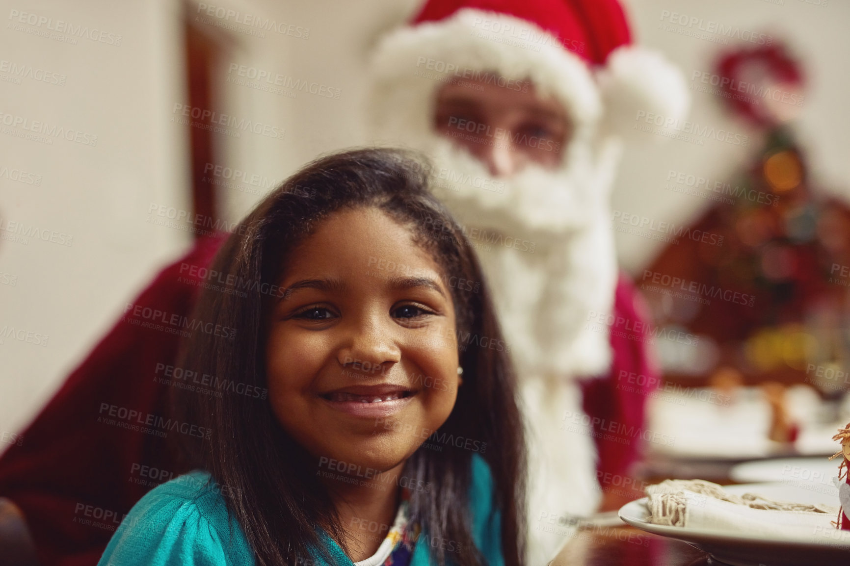 Buy stock photo Portrait of an adorable little girl enjoying Christmas with her family at home