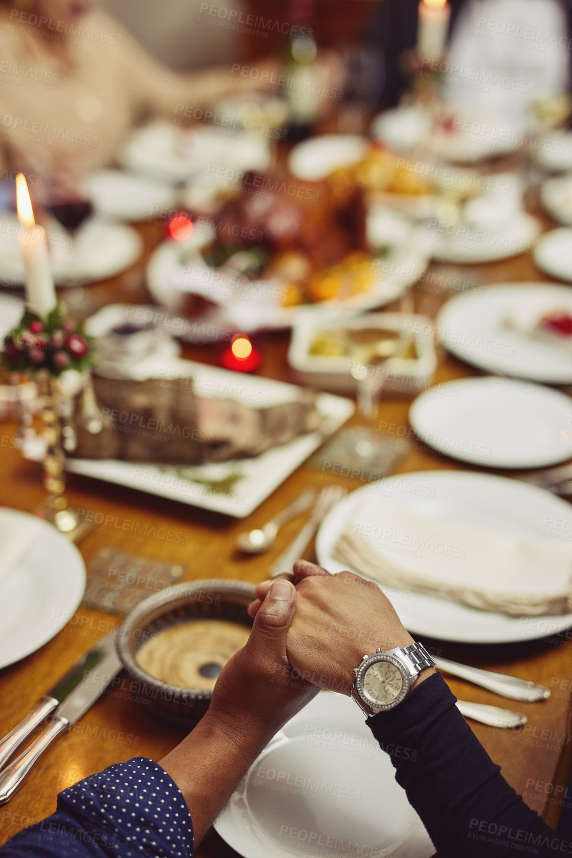 Buy stock photo Prayer, dinner and hand holding with family at table in dining room for holiday, food or praying worship. Celebration, support or gratitude with closeup of people at home for kindness, party and love
