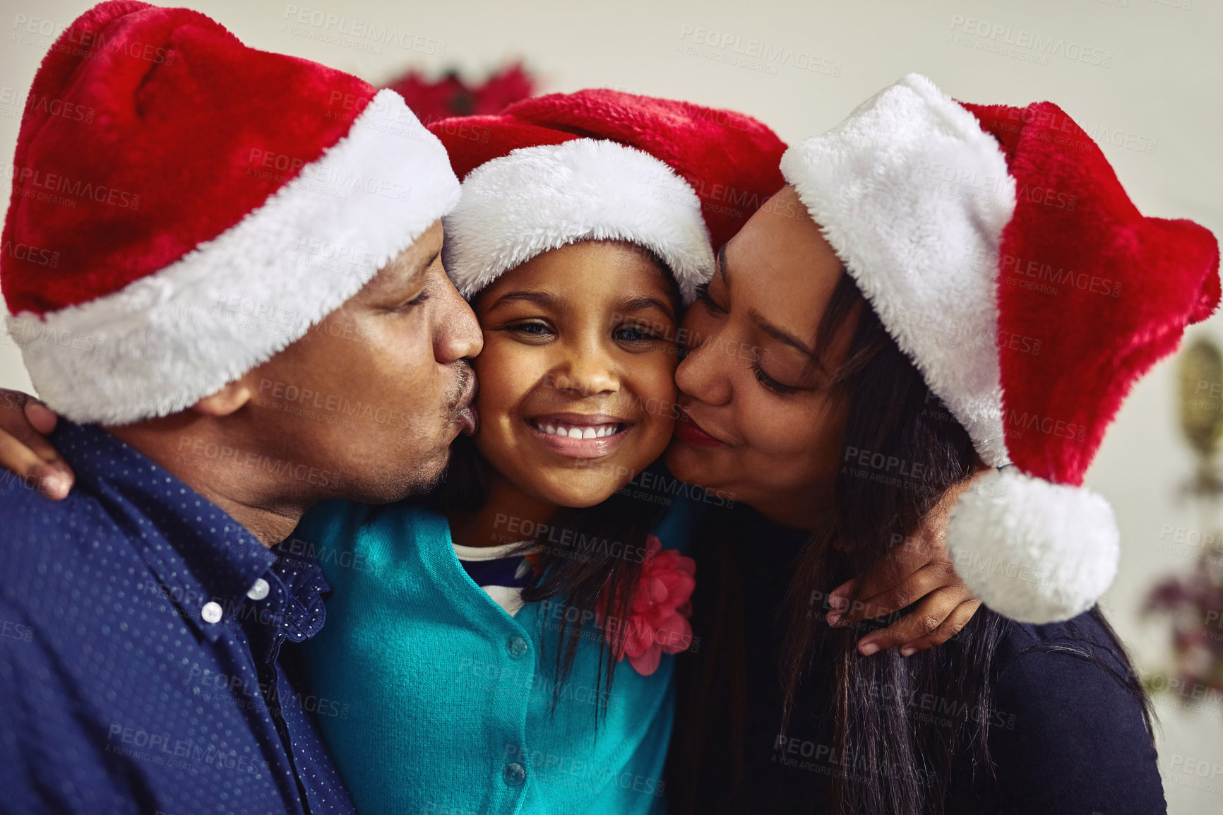 Buy stock photo Shot of a family celebrating Christmas together at home
