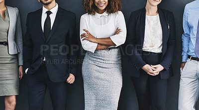 Buy stock photo Group of corporate business people standing against a wall, to voice their opinion. Team of many work colleagues in line wearing formal suit for interview. Executive employees together at company