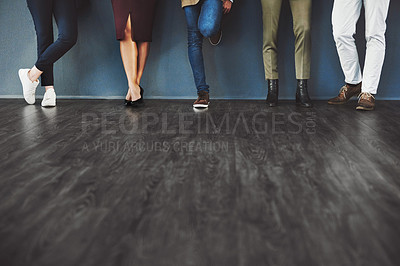 Buy stock photo Cropped studio shot of a group of businesspeople standing in line against a gray background
