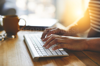 Buy stock photo Cropped shot of an unrecognizable businesswoman typing on a bluetooth keyboard