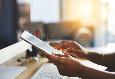 Buy stock photo Cropped shot of an unrecognizable businesswoman working on a digital tablet