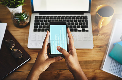 Buy stock photo High angle shot of an unrecognizable businesswoman using a mobile phone