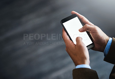 Buy stock photo High angle shot of an unrecognizable businessman using a mobile phone