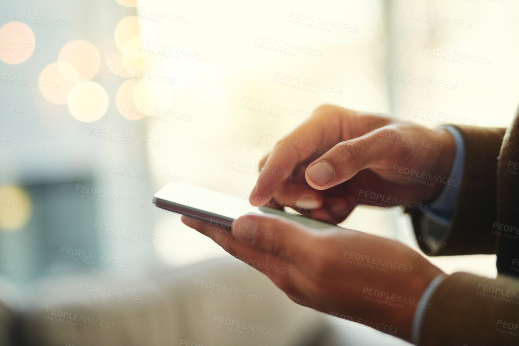 Buy stock photo Cropped shot of an unrecognizable businessman using a mobile phone