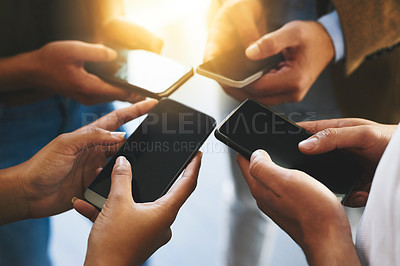 Buy stock photo Business people, hands and sync with phone for network, connection or sharing data at office. Closeup, group or employees with lens flare, mobile smartphone screen or display in circle for transfer