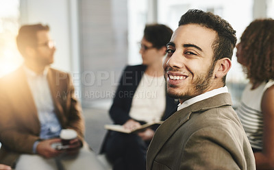 Buy stock photo Portrait of a business man sitting in a meeting with his colleagues