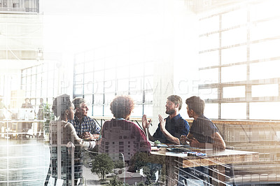 Buy stock photo Multiple exposure shot of businesspeople having a meeting superimposed over a cityscape