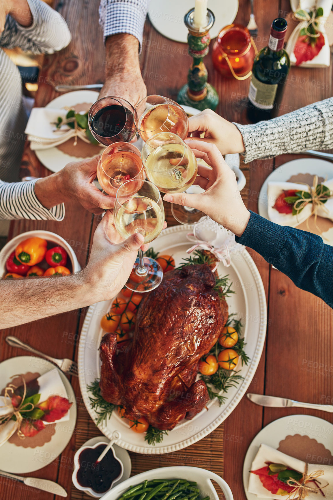 Buy stock photo Hands, toast and turkey for thanksgiving, dinner and celebration outdoor with food, wine and family. Group of people, cheers and together at table for holiday, home and meat with drink or above