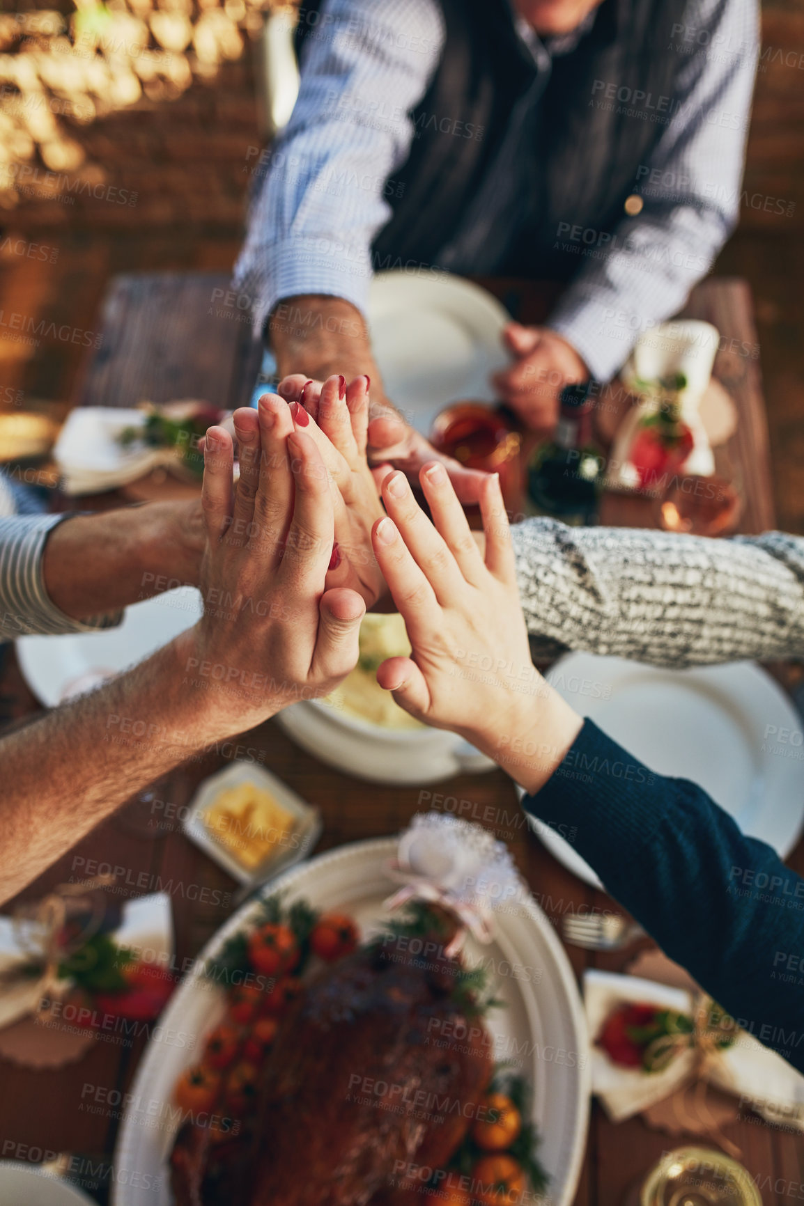 Buy stock photo Family, high five and celebration for food in home, thanksgiving feast and support in tradition. People, hands and motivation for eating goals on holiday, party gathering and together for sharing