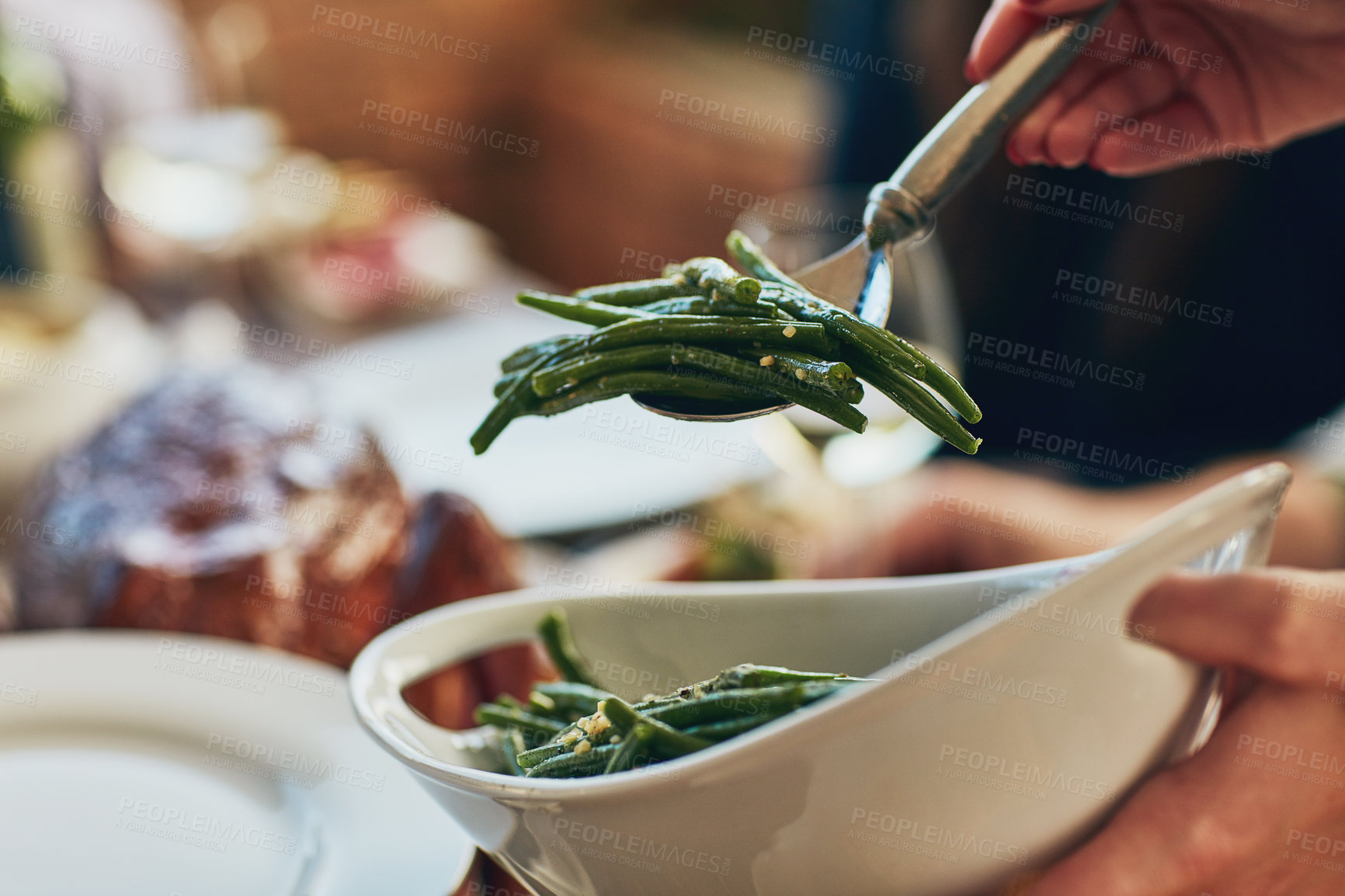 Buy stock photo Cropped shot green beans being served during a feast at a dining table