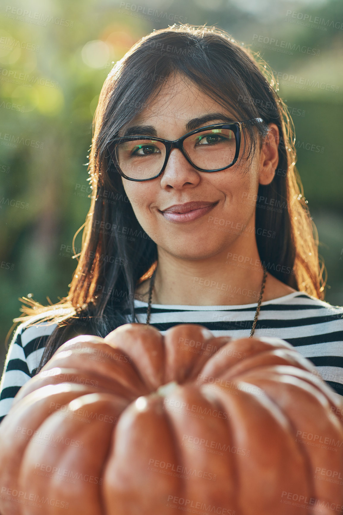 Buy stock photo Portrait, pumpkin and thanksgiving with woman outdoor in garden for celebration or festive event. Face, happy and vegetable with confident person in USA for July holiday or tradition in autumn season