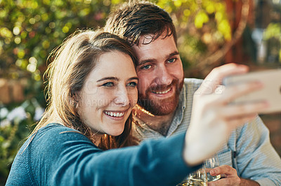 Buy stock photo Cropped shot of a couple taking a selfie