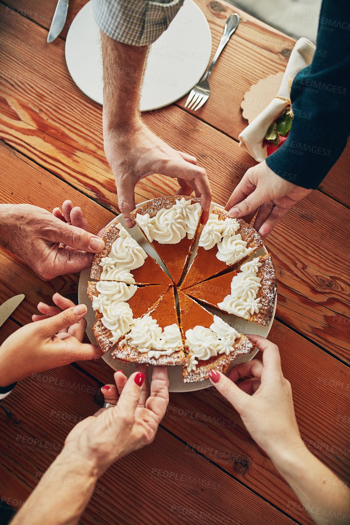Buy stock photo Slice, hands and pumpkin pie for party, wooden table and Thanksgiving with celebration, sweet meal and dessert. Closeup, catering and group with food, snack and people with social gathering and event