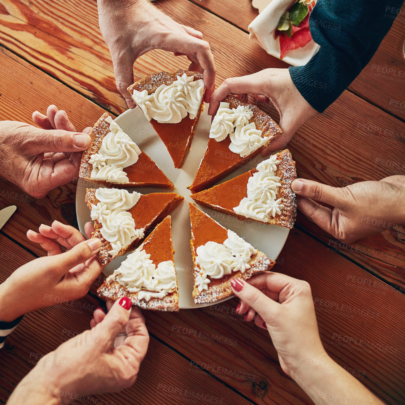 Buy stock photo Cropped shot of a group of people each taking a slice of pumpkin pie