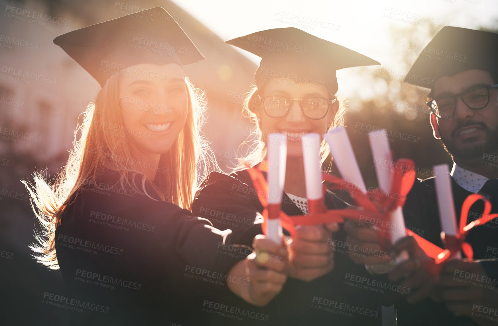 Buy stock photo Hands, portrait and graduation certificate in outdoor, education celebration and support. People, friends and qualified together for university success event, college huddle and degree achievement