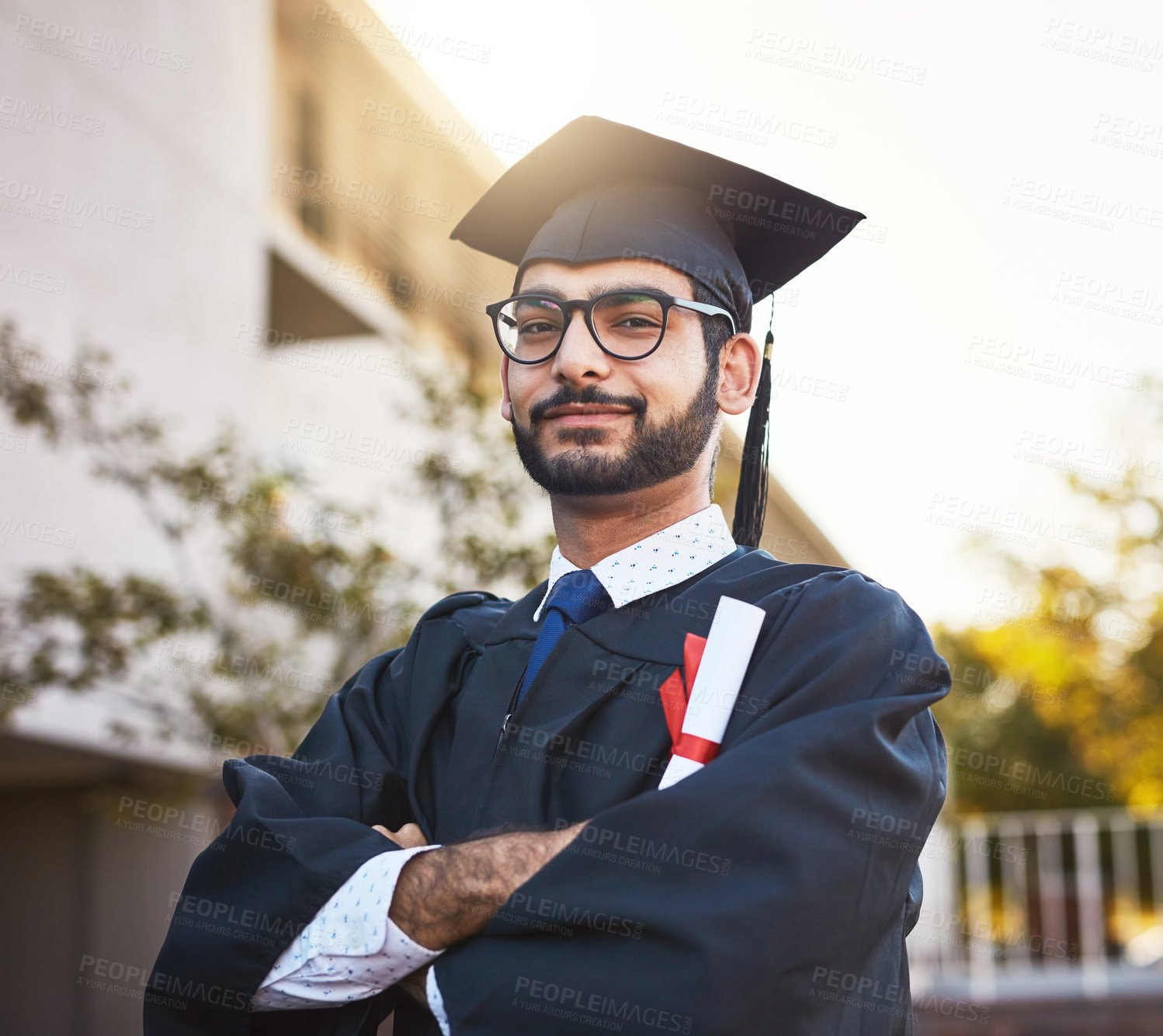 Buy stock photo Portrait, certificate and man with arms crossed for graduation, success or goal outdoor. Face, glasses and graduate student with confidence, pride or education diploma for college achievement in UAE