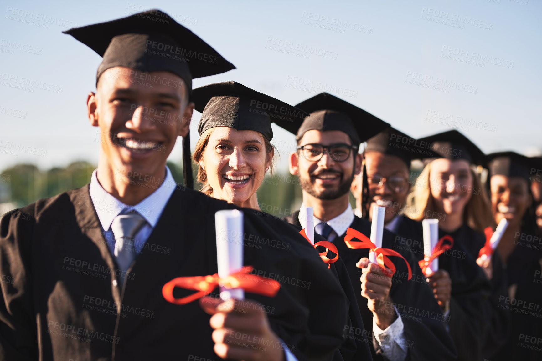 Buy stock photo Certificate, graduation and portrait of student friends outdoor on campus together for ceremony or event. Diversity, education and smile in line with group of happy graduate people at university