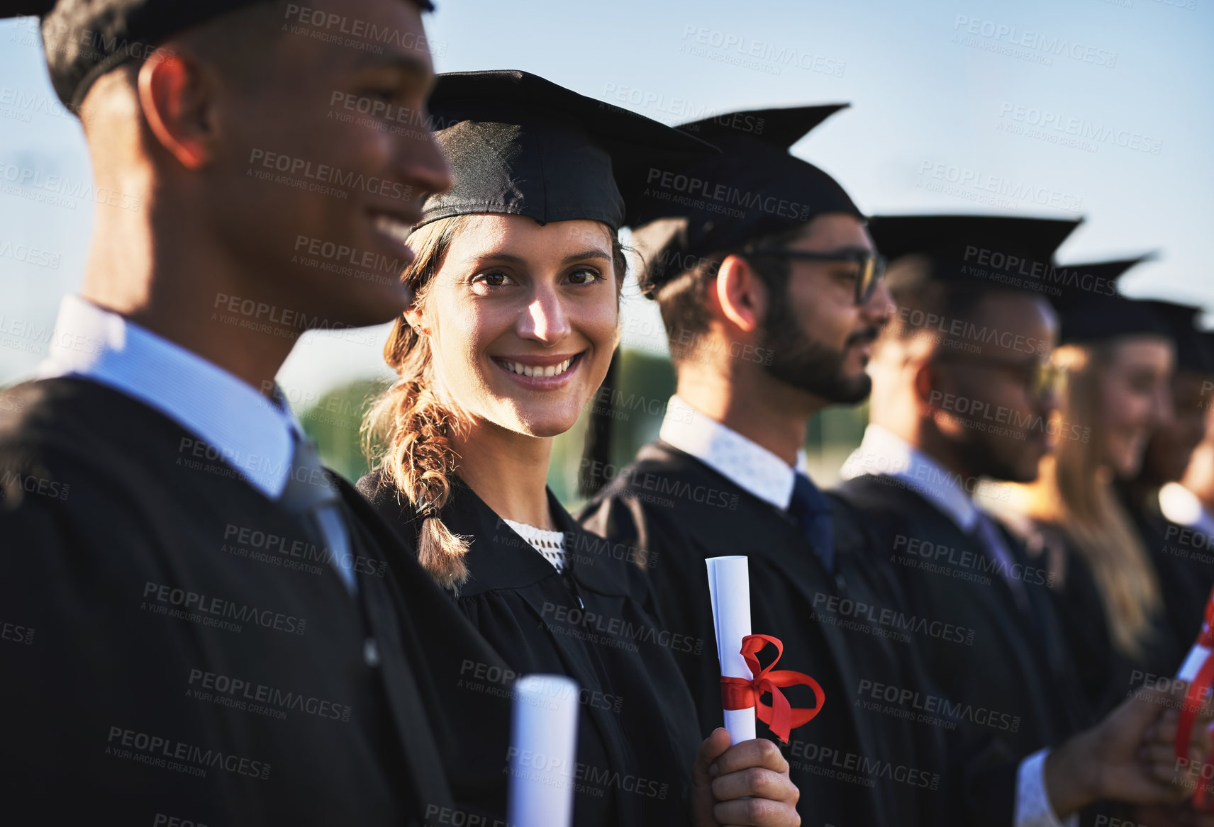 Buy stock photo Certificate, graduation and portrait of student woman outdoor with friends for university ceremony or event. Celebration, diversity and education with group of happy graduate people on campus