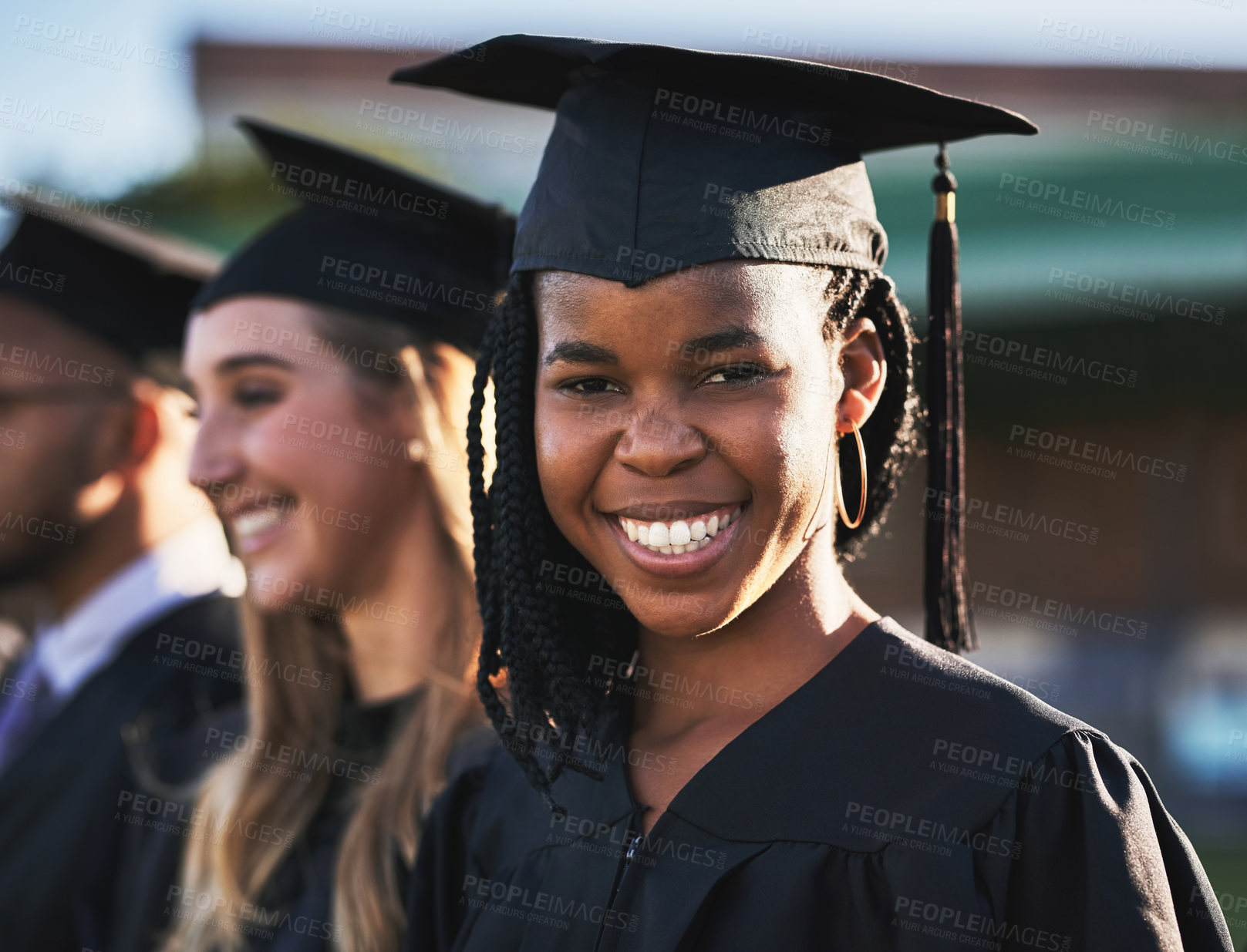 Buy stock photo Happy black woman, students and graduation ceremony with class group for education, qualification or future. Portrait of person or scholar with smile for diploma, certificate or degree on campus