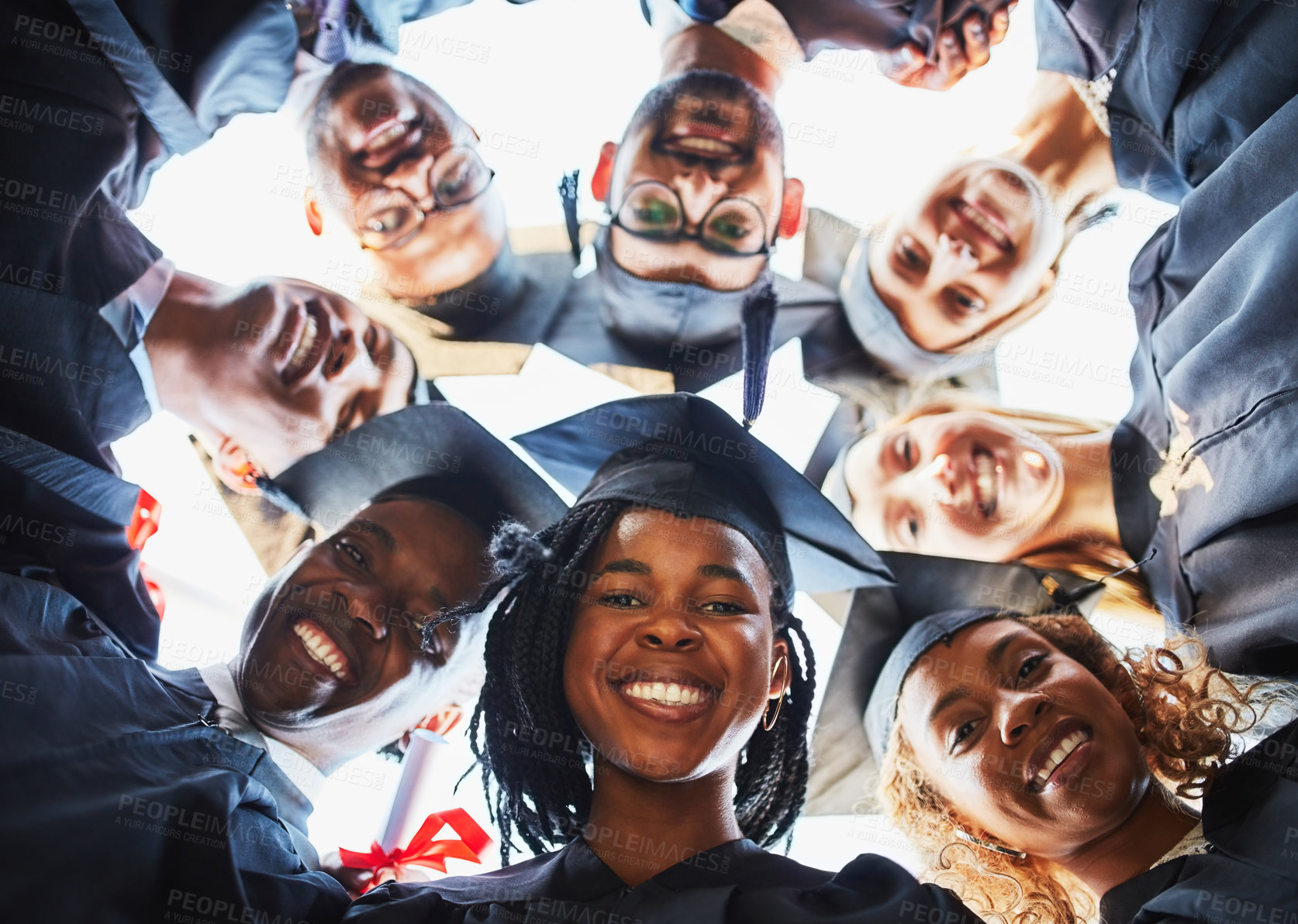 Buy stock photo Graduation, university and portrait of students in circle for ceremony, celebration and academic achievement. College degree, friends and below of men and women for education, learning and studying