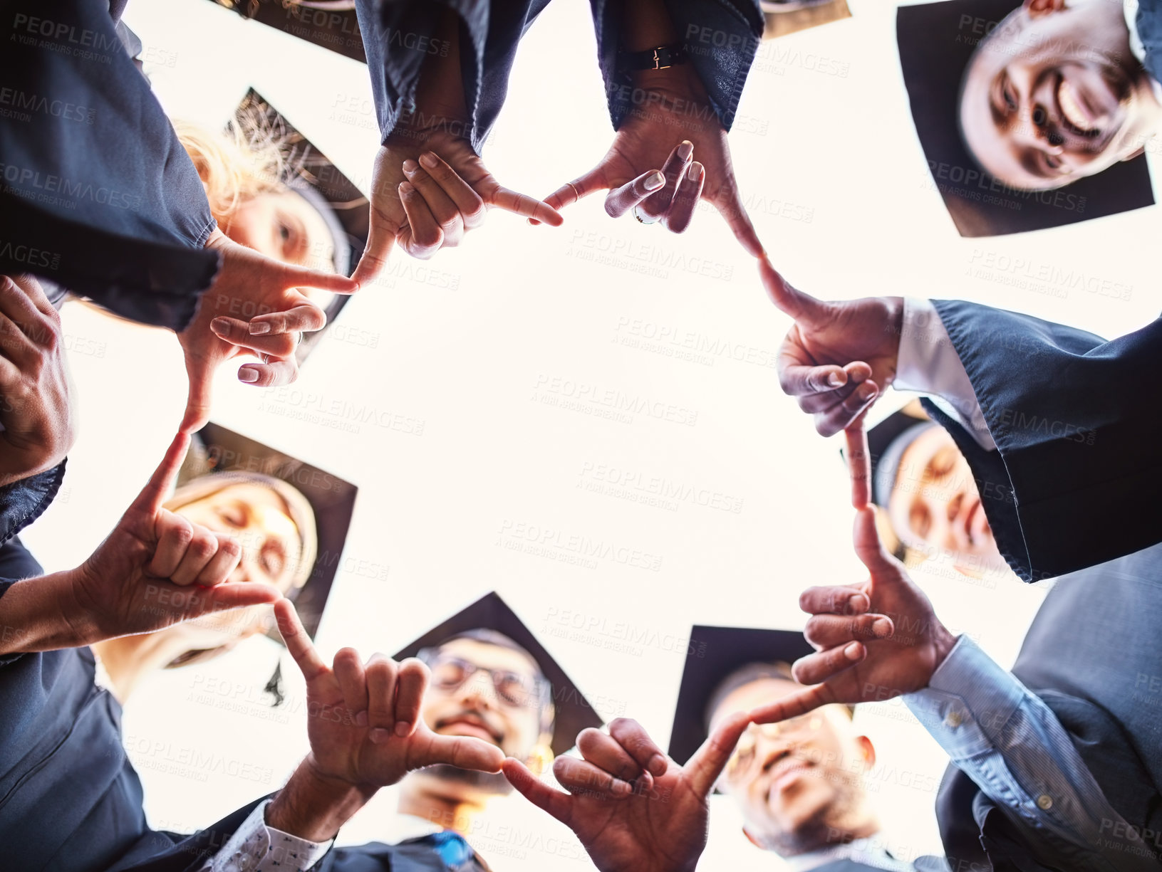 Buy stock photo Hands, circle and students for graduation, celebration and university outdoor with academic success. Graduate, link and people for achievement, education and college and congratulations in low angle