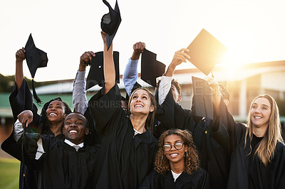 Buy stock photo Shot of a group of cheerful university students on graduation day