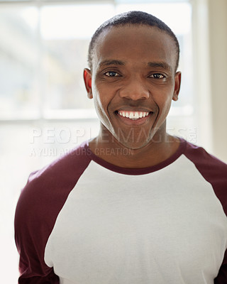 Buy stock photo Portrait of a confident young man standing indoors