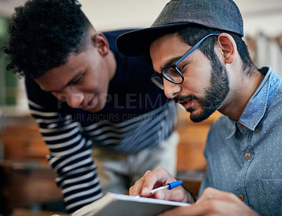 Buy stock photo Cropped shot of university students studying together in class