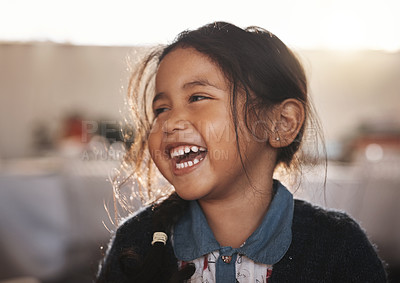 Buy stock photo Happy, kid and girl laughing in a living room, playing and having fun in her home. Child, development and Mexican female toddler with funny, joke or reaction to comedy, goofy and crazy in her house