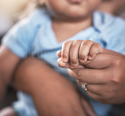 Buy stock photo Family, holding hands and parent with baby closeup in home for love, safety or support together. Bonding, security or trust with person and infant kid in apartment for child development or growth