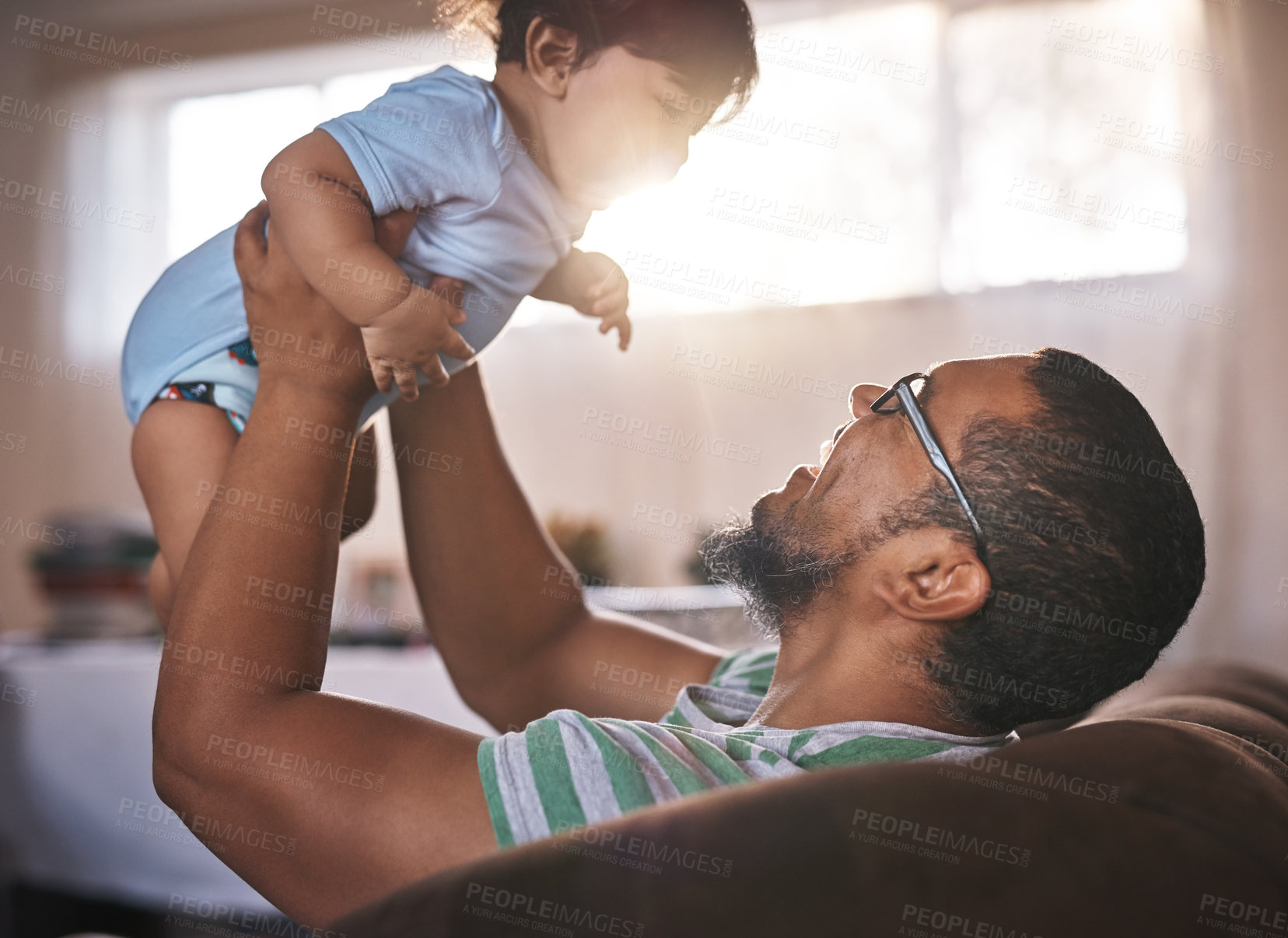 Buy stock photo Happy, father and lifting baby at house with airplane game, bonding and support for fantasy play on weekend. Excited, man and boy for love, trust and child motor or sensory development at home