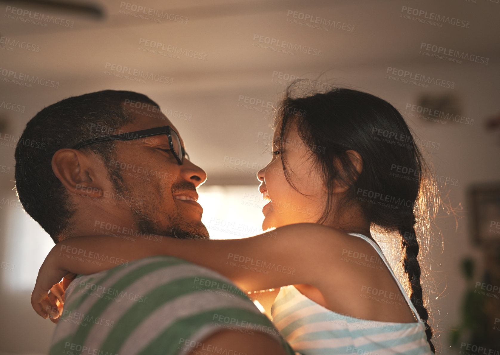 Buy stock photo Father, hug and child with love at house for support, safety or care by bonding together in childhood. Smile, girl and man relax in embrace of gratitude, trust or security of parent in living room
