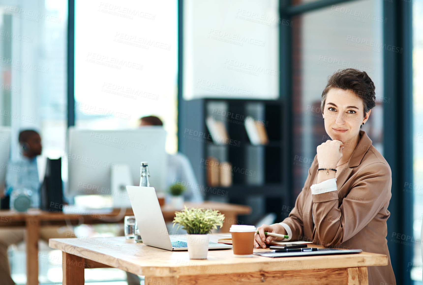 Buy stock photo Cropped shot of a young designer working at her desk