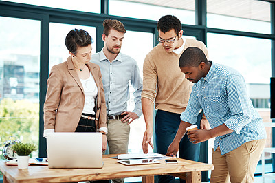 Buy stock photo Cropped shot of a team of designers brainstorming together in an office