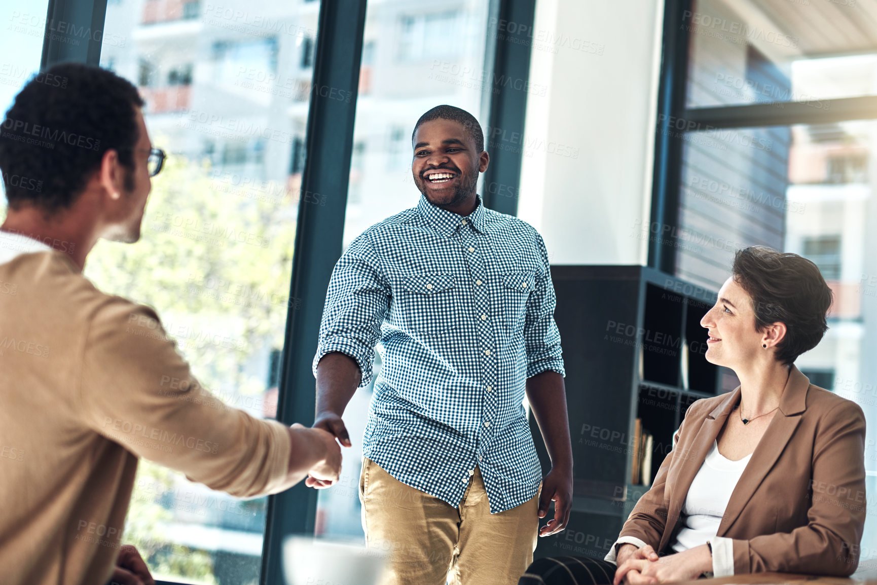 Buy stock photo Shot of designer shaking hands in the office