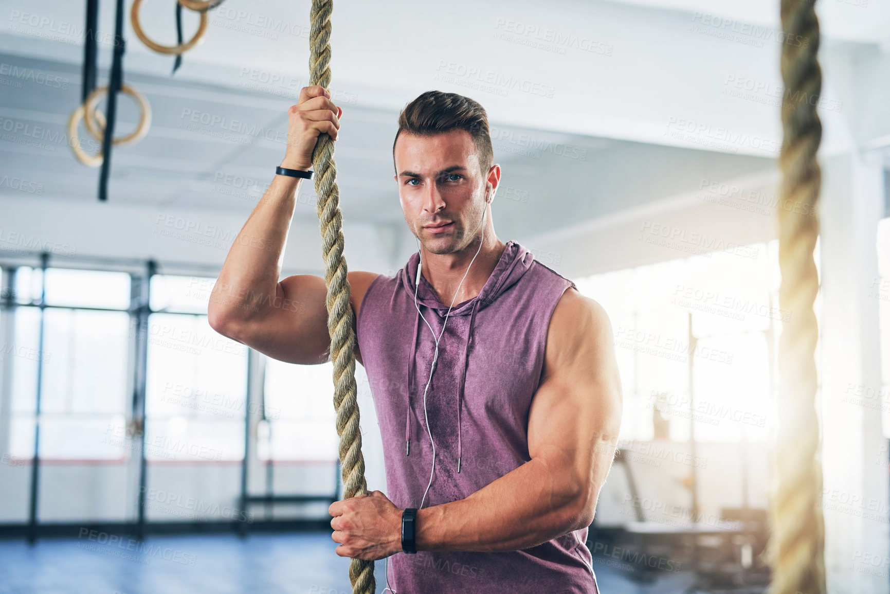 Buy stock photo Rope, fitness and man in gym, portrait and exercise with training, wellness and endurance. Face, athlete and healthy guy in facility, cardio workout and energy with mindset, confidence and challenge