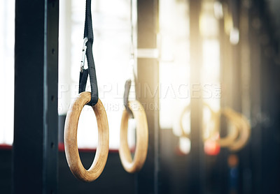 Buy stock photo Shot of gymnastic rings at the gym