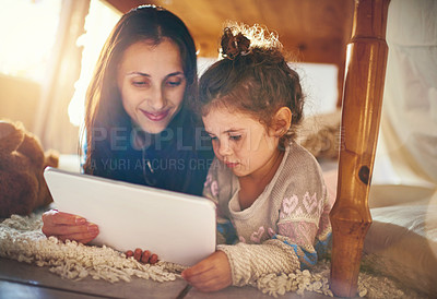 Buy stock photo Home, mama and girl with tablet, relax and social media with online game, bonding together and love. Family, single parent and mother with daughter, tech and digital app for cartoon film or movie