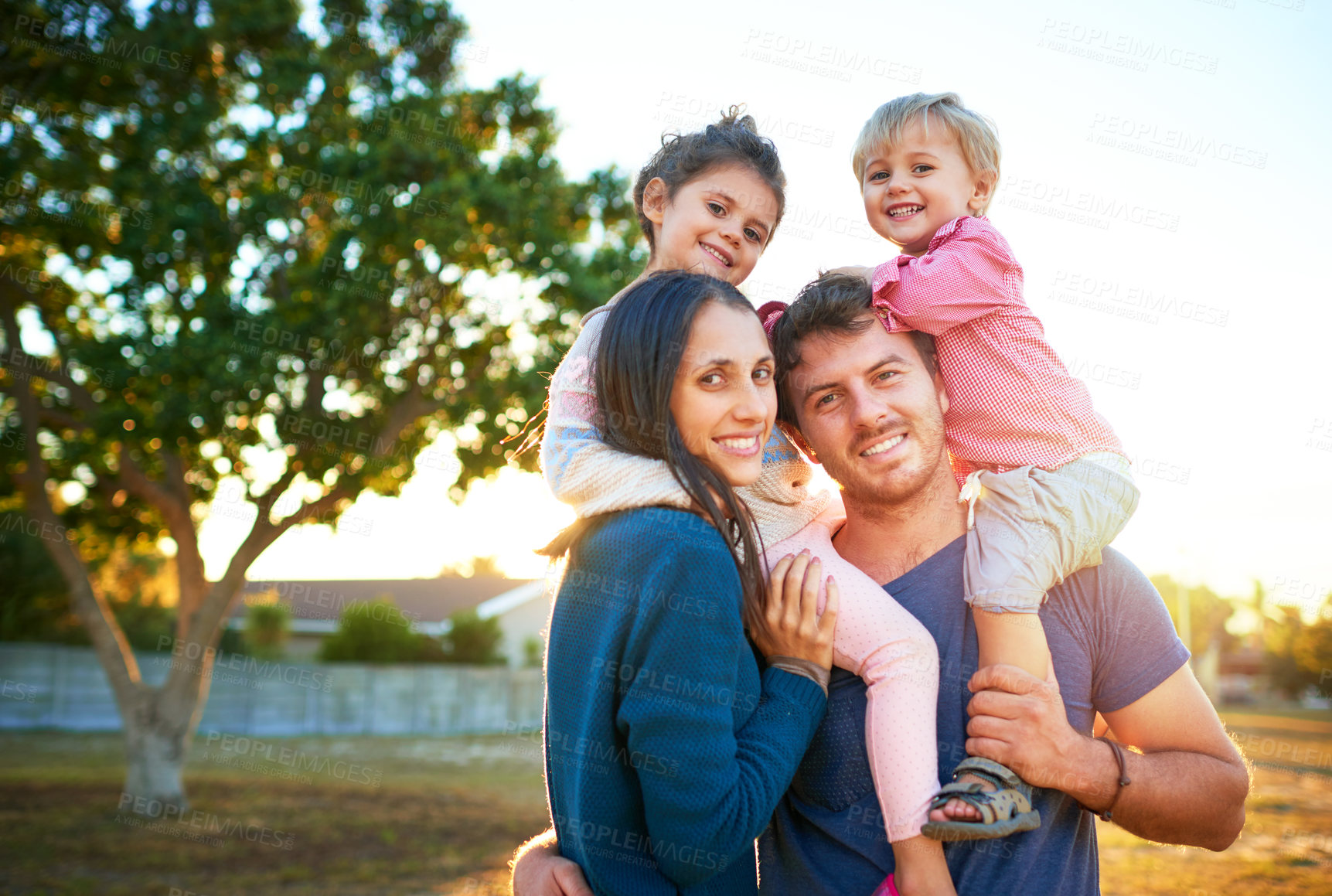 Buy stock photo Portrait of a happy family bonding together outdoors