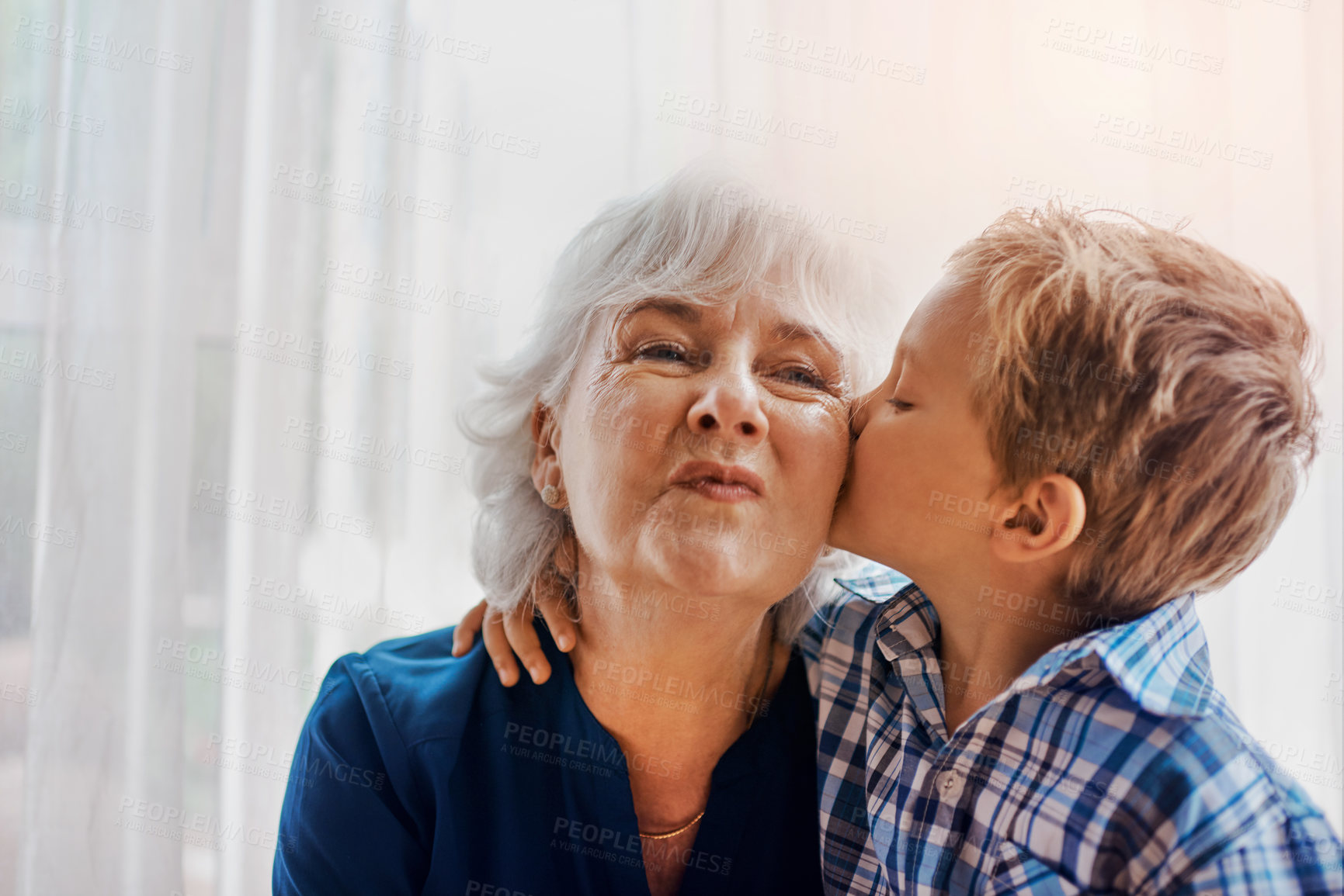 Buy stock photo Cropped shot of a senior woman spending time with her loving grandson