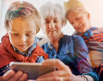 Buy stock photo Shot of a senior woman spending time wither her grandsons