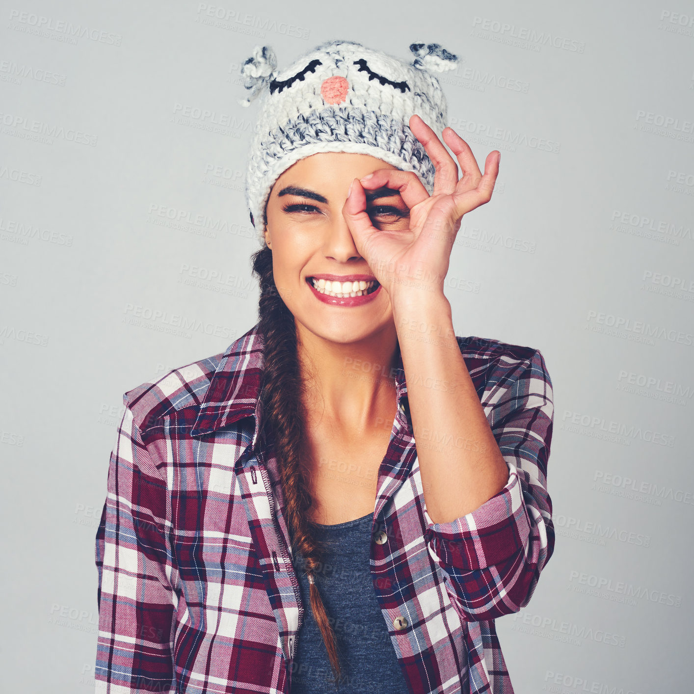 Buy stock photo Binocular hand, happy and portrait of woman in studio with casual, trendy and stylish fashion. Smile, emoji and female person from Brazil with searching gesture for discovery by white background.