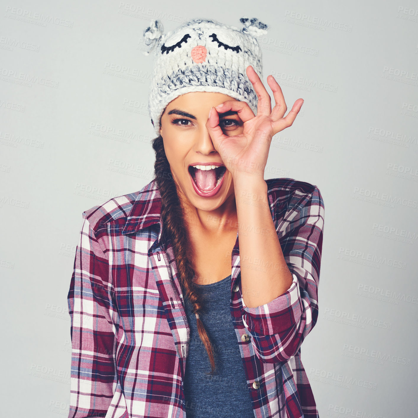 Buy stock photo Binocular hand, smile and portrait of woman in studio with casual, trendy and stylish fashion. Happy, emoji and female person from Brazil with searching gesture for discovery by white background.