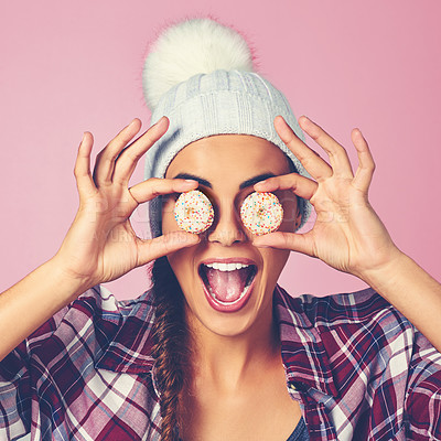 Buy stock photo Cookies, surprise and face of woman in studio for pastry chef, sweet and confectionery bakery. Wow, sugar and news with person and biscuit on eyes on pink background for dessert, food and candy