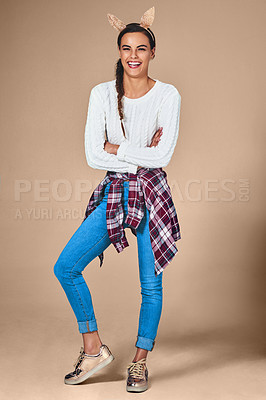 Buy stock photo Shot of an attractive young woman posing in the studio