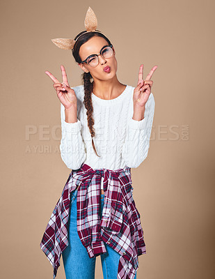 Buy stock photo Woman, peace sign and pout in portrait by studio, face expression and confidence with personality. Female person, happy model and emoji reaction with v symbol for fashion, headband and background