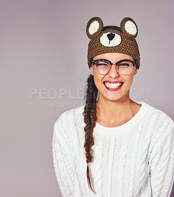 Buy stock photo Studio, woman and excited in portrait for fashion, winter outfit and teddy bear beanie for style. Female person, smile and model with pride for crochet headband, wool and mockup space by background