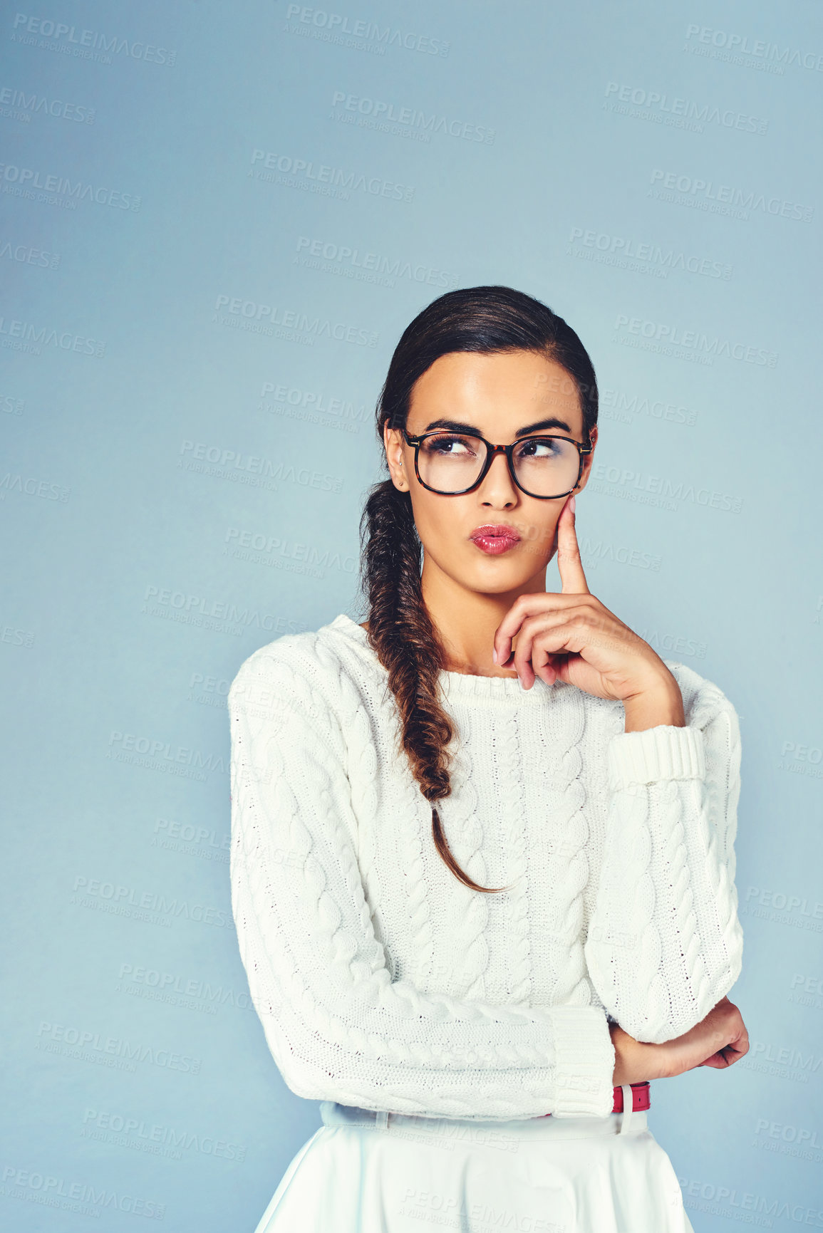 Buy stock photo Thinking, glasses and woman with brainstorming in studio for future, vision or planning with mockup space. Ideas, solution and female person with guess, question or decision by blue background.